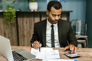 Gentleman working on tax preparation paperwork