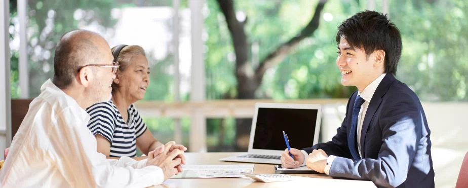 Tax expert meeting with his clients to go over tax resolution plans